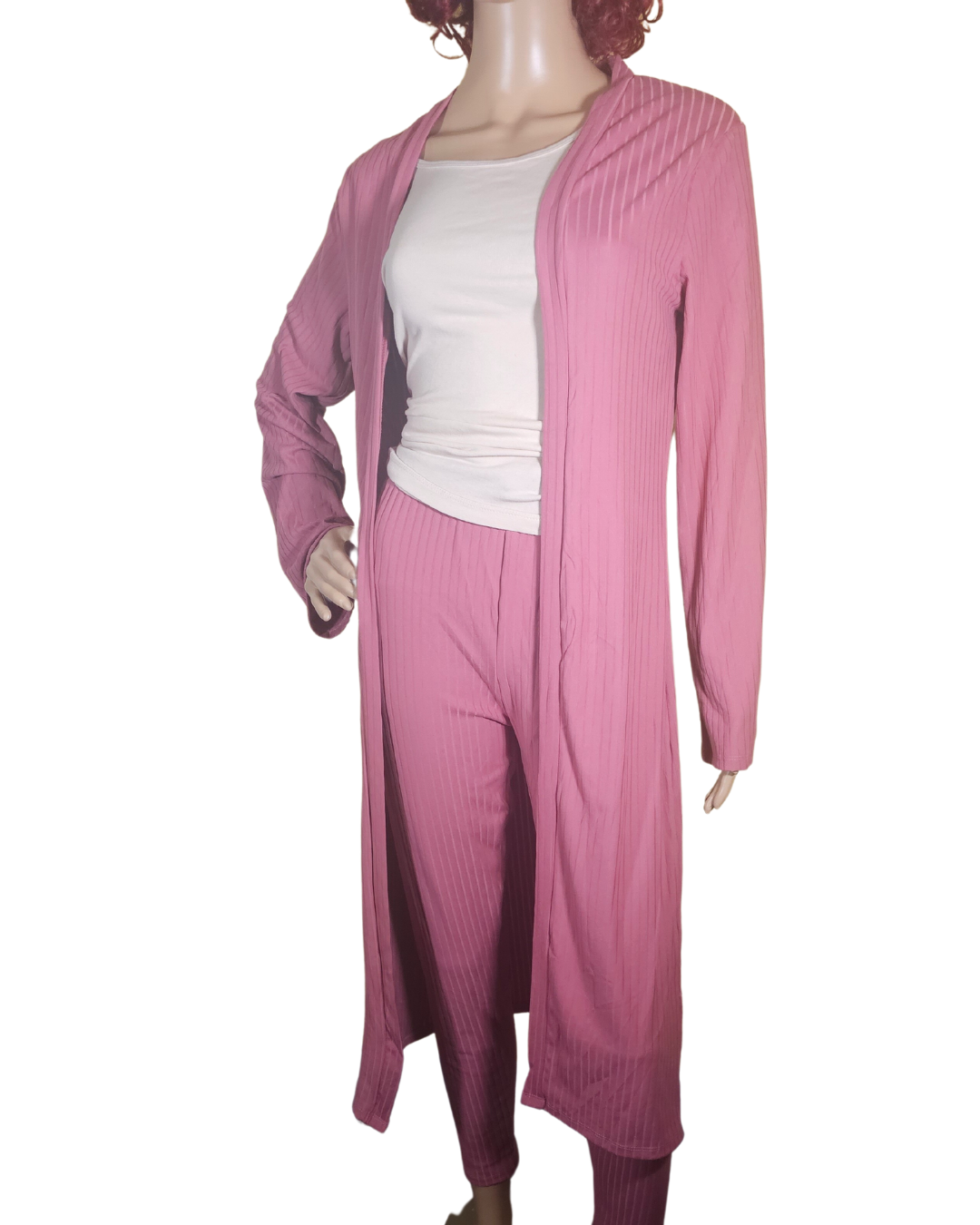 Small-Large in size. pink 2 pc cardigan set. the pants are legging pants with a decorative string in the front.