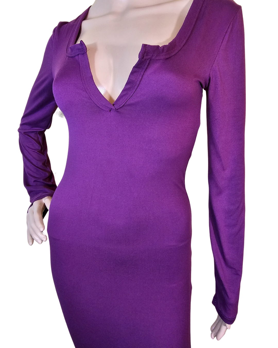 small-large, purple soft material dress that fits your curves and has a v-neck in the front. the dress goes pass your knees. long sleeves