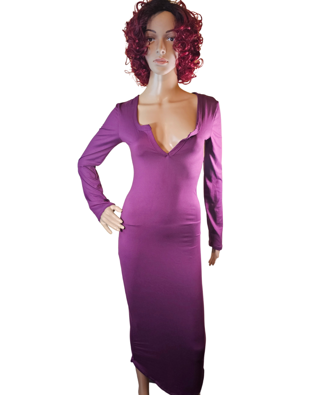 small-large, purple soft material dress that fits your curves and has a v-neck in the front. the dress goes pass your knees. long sleeves