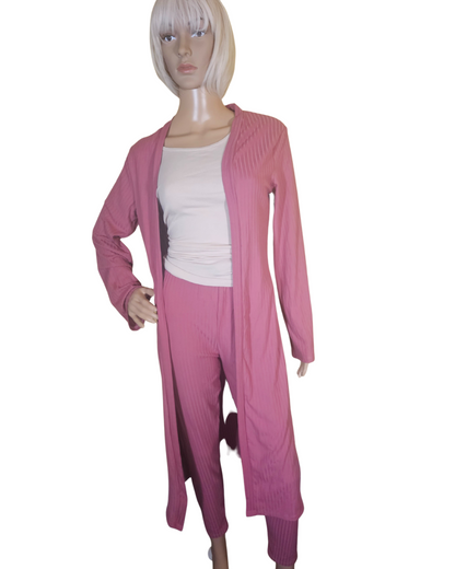 Small-Large in size. pink 2 pc cardigan set. the pants are legging pants with a decorative string in the front.